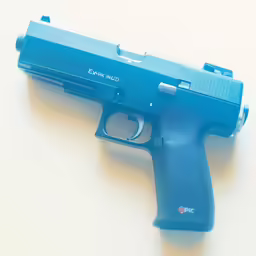 a toy gun is laying on the floor