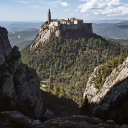 a rocky mountain landscape with a castle on top
