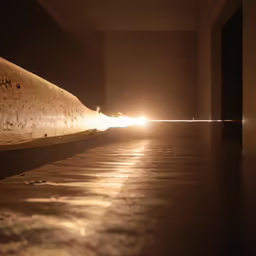 a very long piece of metal sitting on a floor
