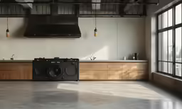 a kitchen area with a window and a washing machine