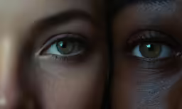 two blue eyes and brown hair are reflected in the same photo