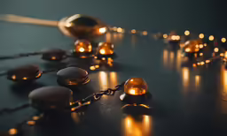 some gold chains that are lit up with lights
