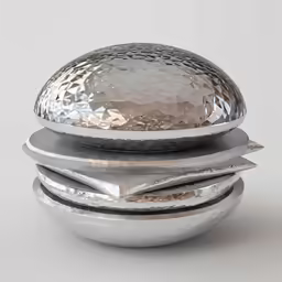 a metal ball sitting on top of two pieces of metal