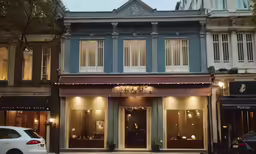 a car is parked in front of a building