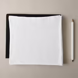 the notepad is next to a pen and paper