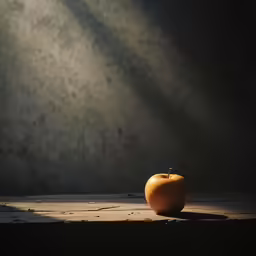 an apple is sitting on a wooden surface
