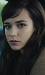 a close up photo of a person with long dark hair