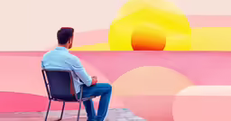 man in a blue shirt sitting in a chair near a painting