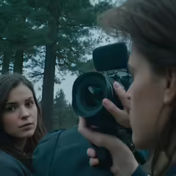 a person holding a camera up to their face
