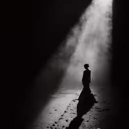 black and white photograph of a man in a hat