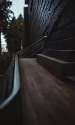 a close up view of a railing and wooden steps