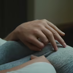 a person who is holding their hand up