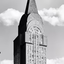 a church steeple with a massive sundial in the center
