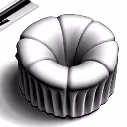 a cupcake sitting next to a video game controller