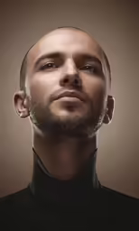 a male in a black shirt with a beard