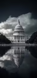 the capital building stands out against dark clouds