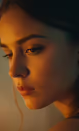 the girl is staring straight ahead wearing earbuds