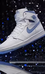 a pair of white and blue sneakers is on display
