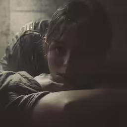 a man resting on a bed in a room