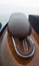 there is a wooden pad attached to the back of a boat