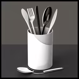 a white cup has forks, spoons and a knife in it