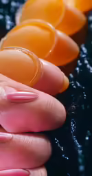 some people with a manicure holding plastic objects
