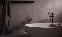 a white tub with some towel on it