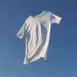 the clothes are hanging on the clothesline outside