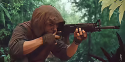 a man in a hooded hood is holding an akuri rifle