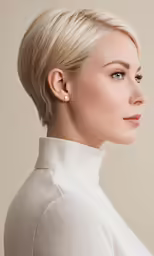 a woman in a white top wearing short hair