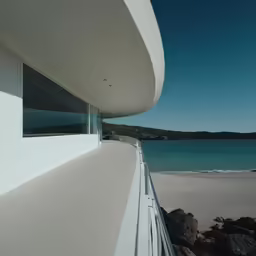 a beachfront house overlooking a large body of water