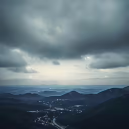 view over town on cloudy day from mountain top