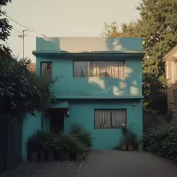 a blue house is painted a slightly hazy shade