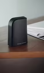 an open speaker is shown on the table