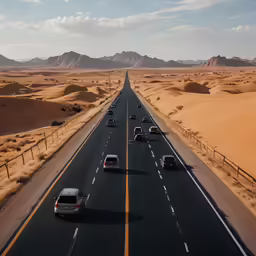 an highway through the desert surrounded by hills
