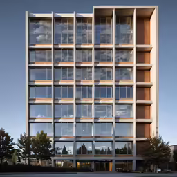 the tall building has a very long window on the front