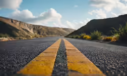 yellow line painted on the side of a roadway