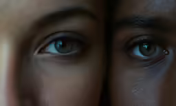 the eyes of an asian man and a young woman in blurry motion