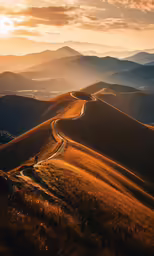 a dirt road stretches into the distance in front of a sunset