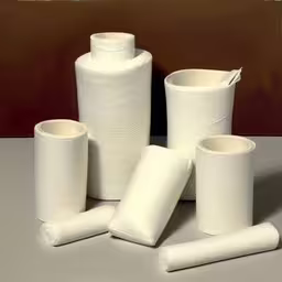 many rolls of paper are in one photo,a bunch of toilet paper are set on the table