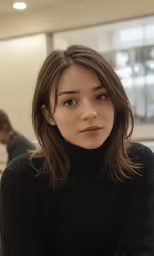 a woman is posing for a picture, she has brown hair