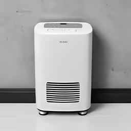 a portable air purificater sits against the wall