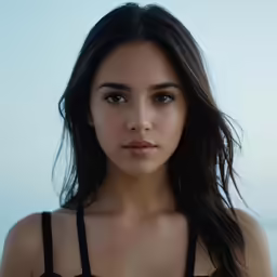 a woman in a bra top and black skirt