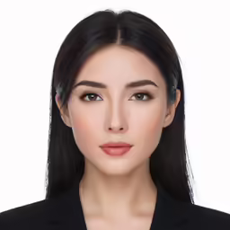 the image of an attractive young woman in black suit