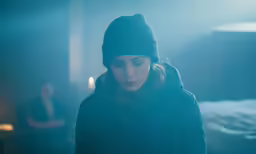 a person in the dark looking at something