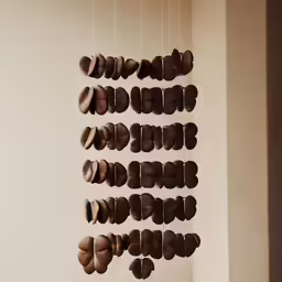 a brown hanging chocolate donut mobile