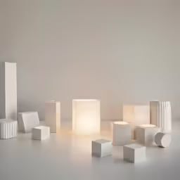 the table lamp sits over a number of blocks of light