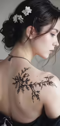 a woman wearing flower hair clip and tattoo design