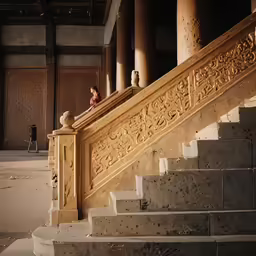 there is a man that is standing on the steps