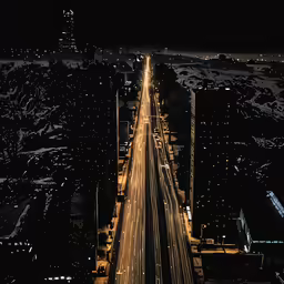 the aerial view of an elevated highway in city at night